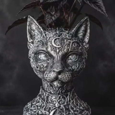 Video of The Witch's Familiar Cat Planter in a dark gothic product setting