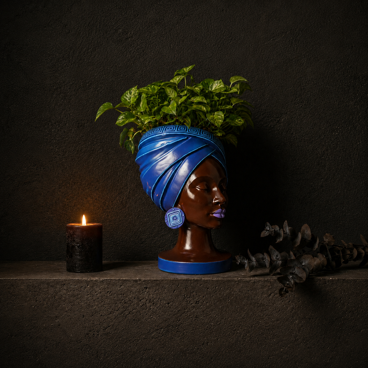 Adire Night black and gold head planter with houseplant