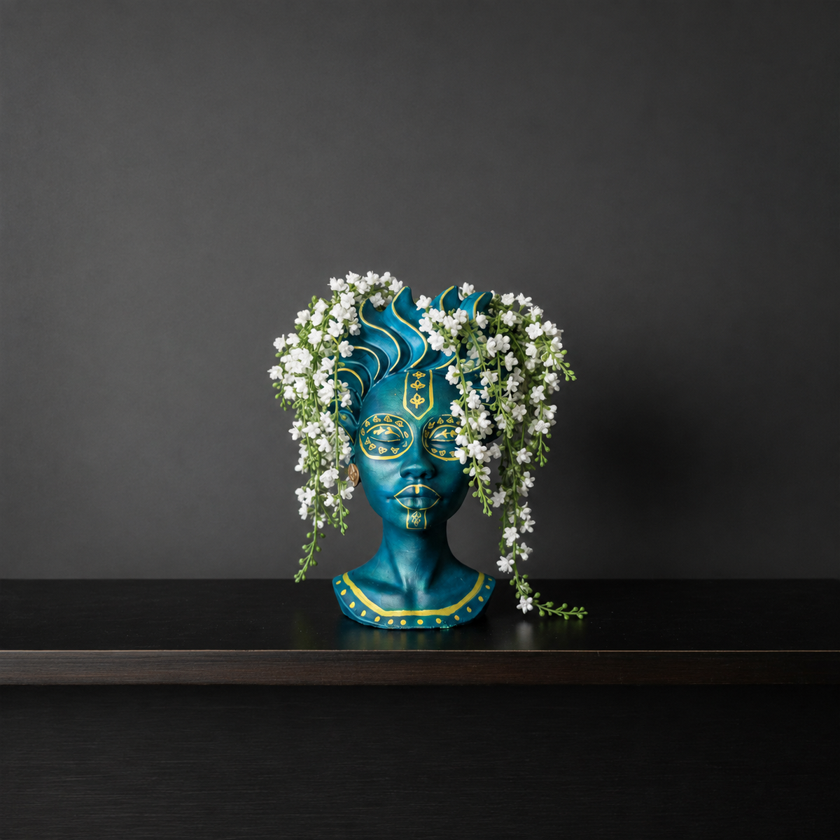 Teal face plant pot with gold wave crown