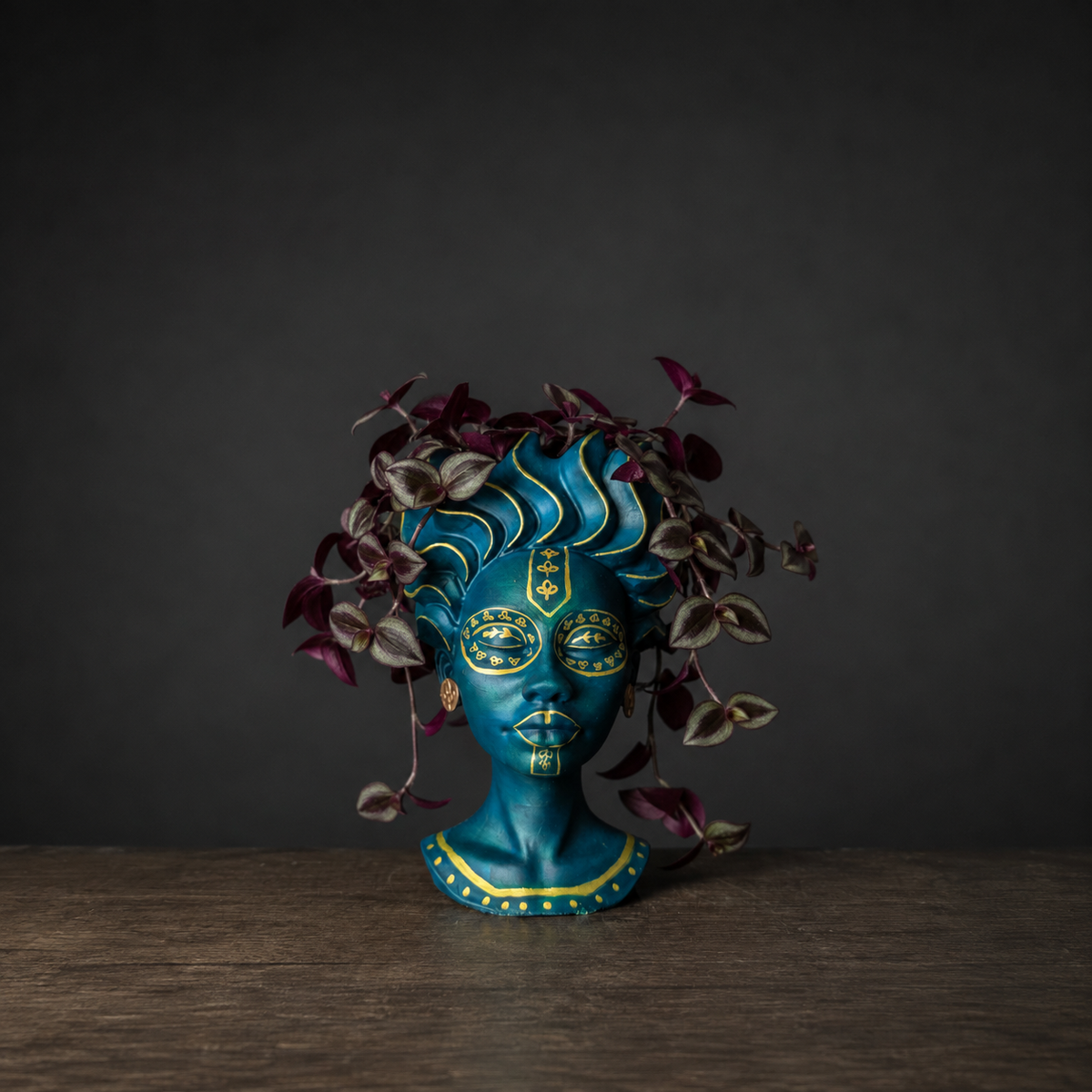 Cast stone teal face plant pot detail