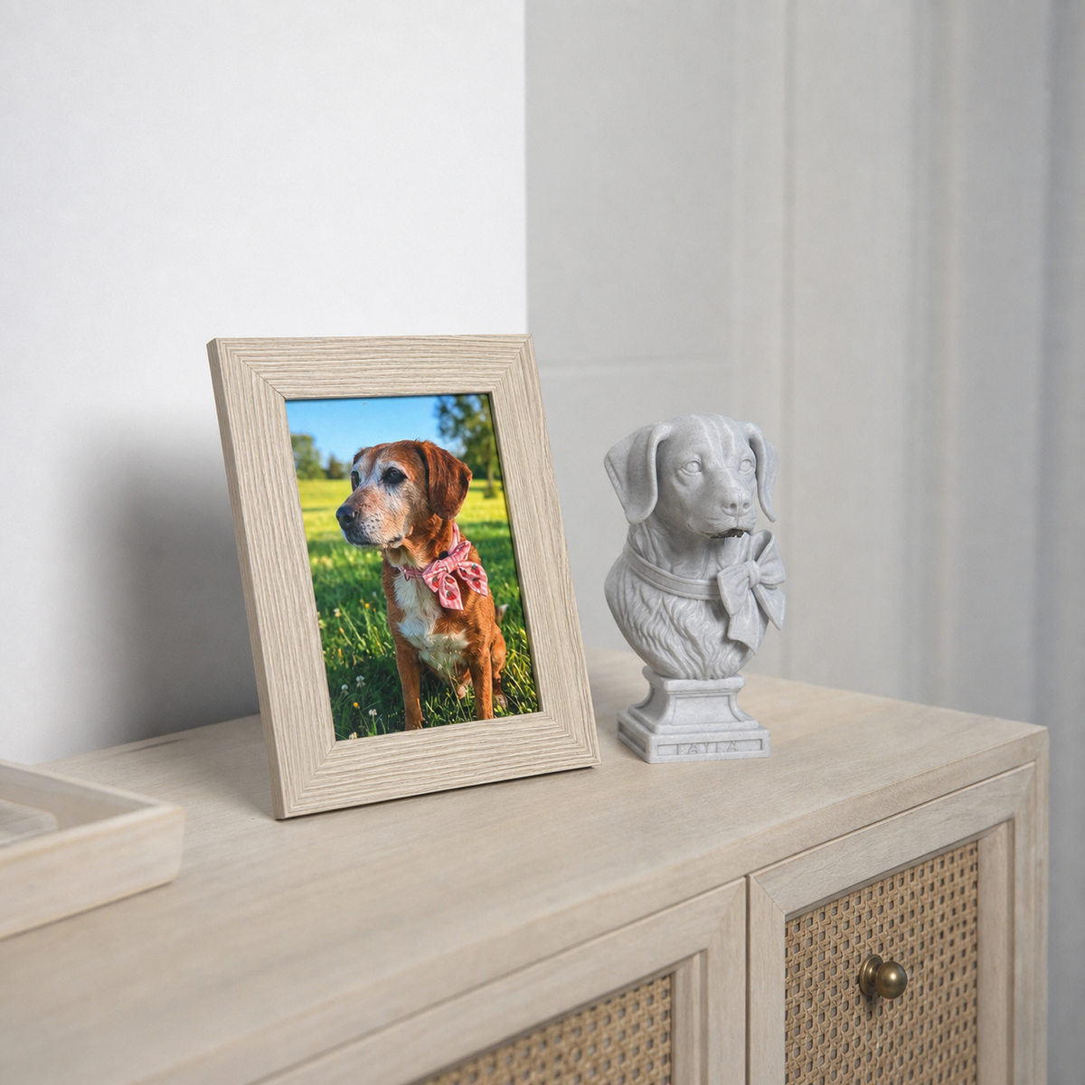 Finished custom dog bust displayed beside pet photo