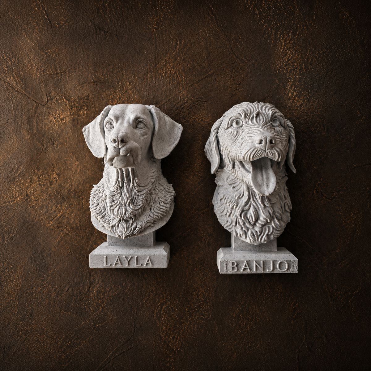 Two personalised dog memorial wall sculptures with engraved name bases