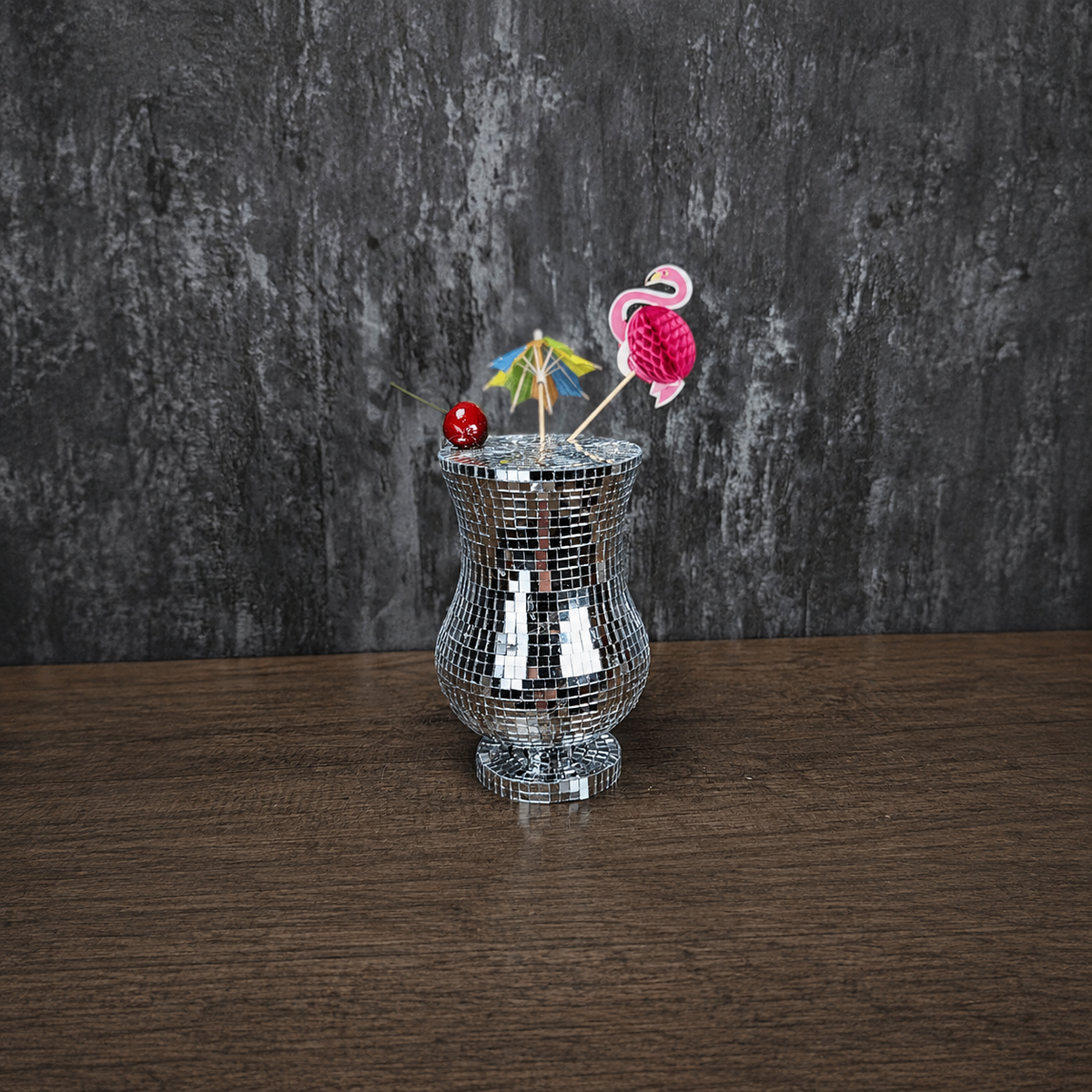Silver mirror Pina Colada glass with colourful tropical garnish