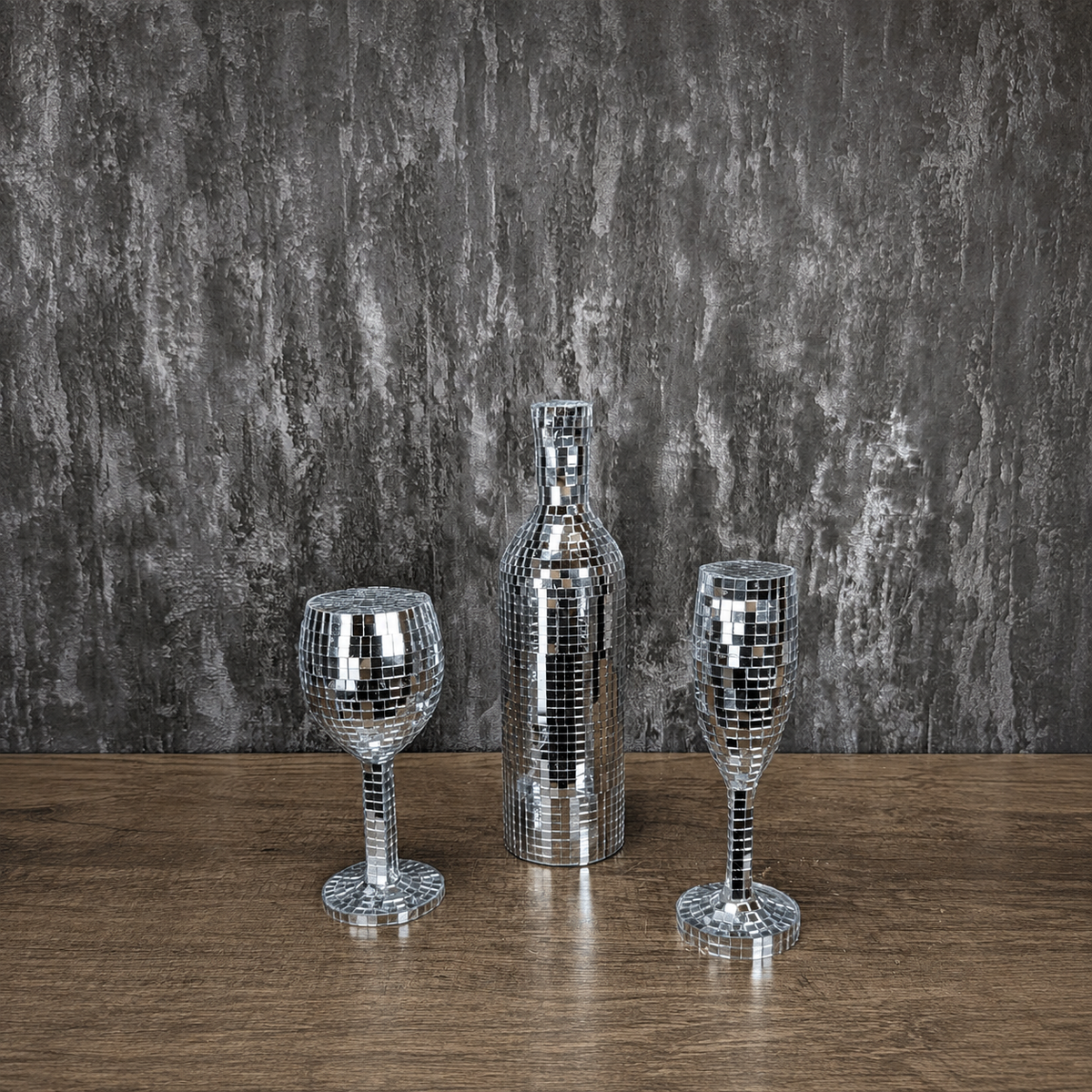 Silver mirror wine glass, bottle and champagne flute, front view
