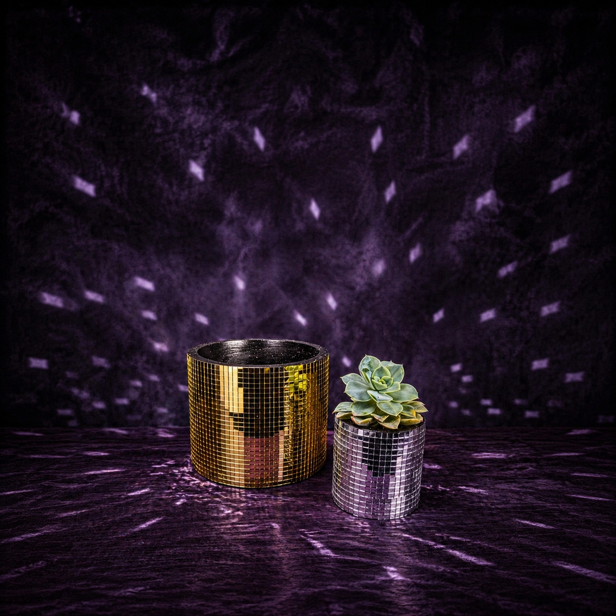 Large gold and small silver mirror-tile plant pots shown together