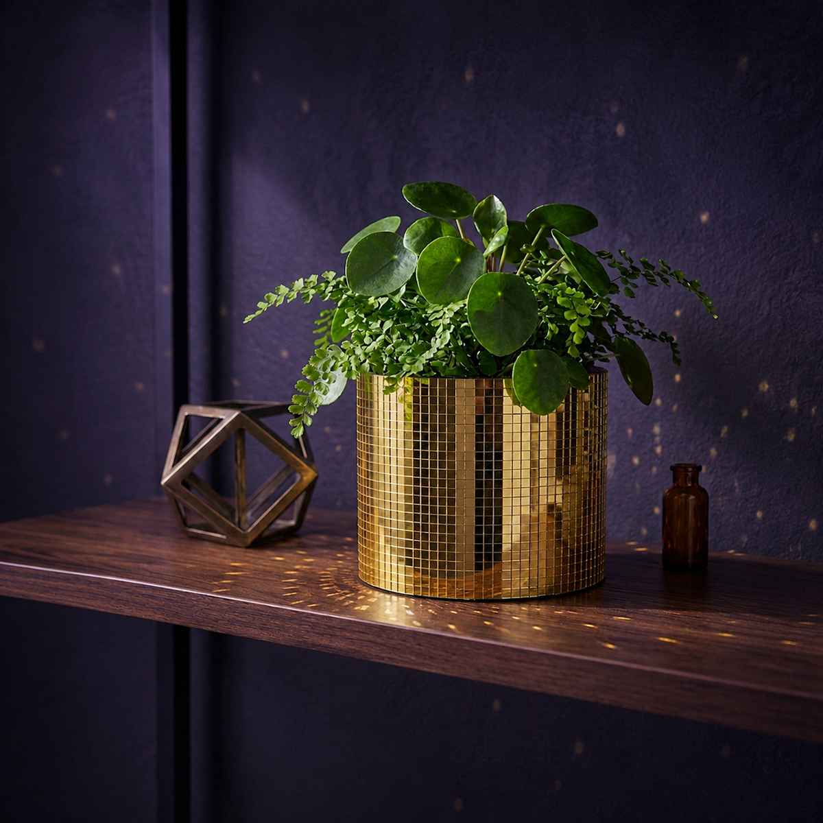 Gold mirror mosaic cylinder planter with leafy houseplant