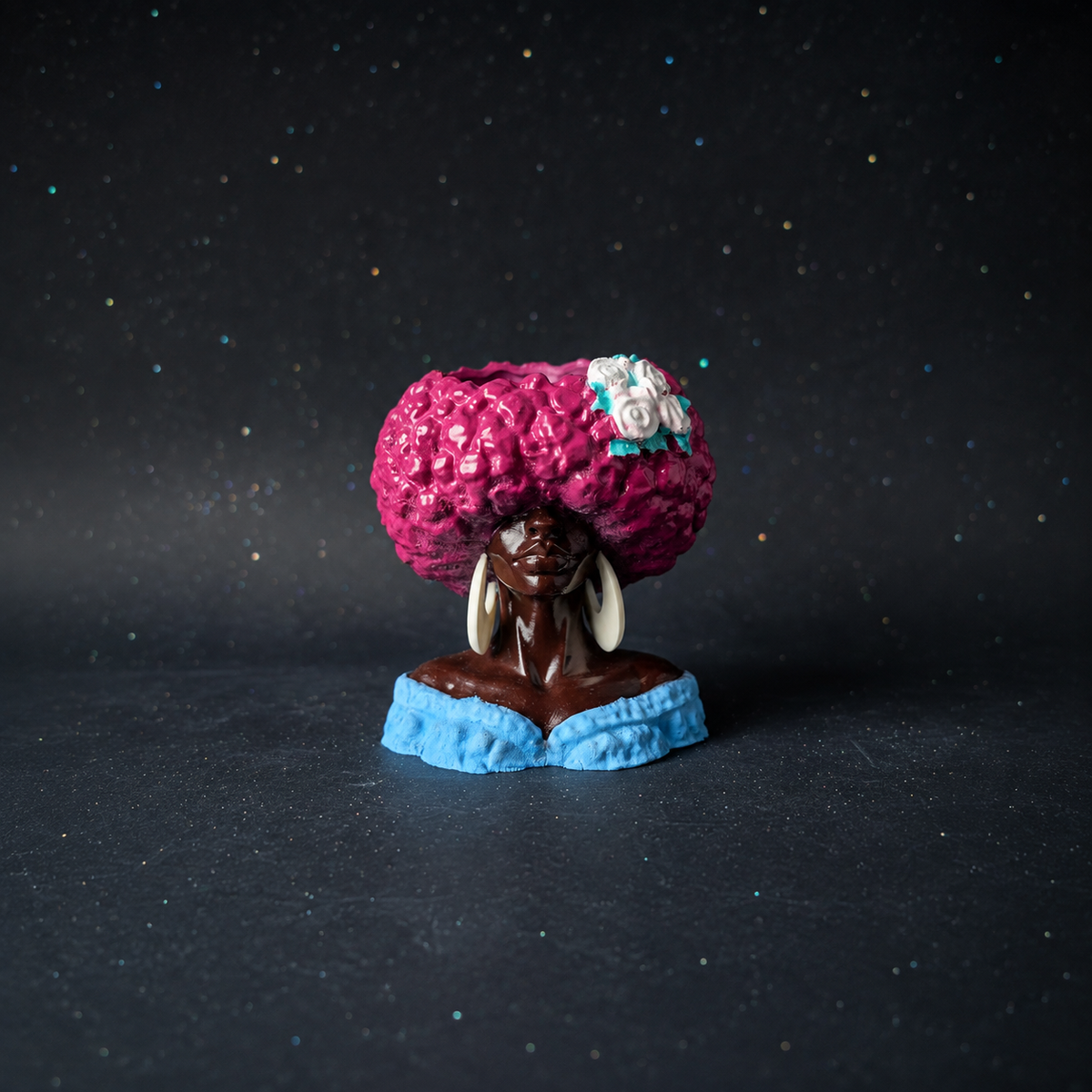 Unplanted Girl Juice head planter shown front-on against a dark studio backdrop