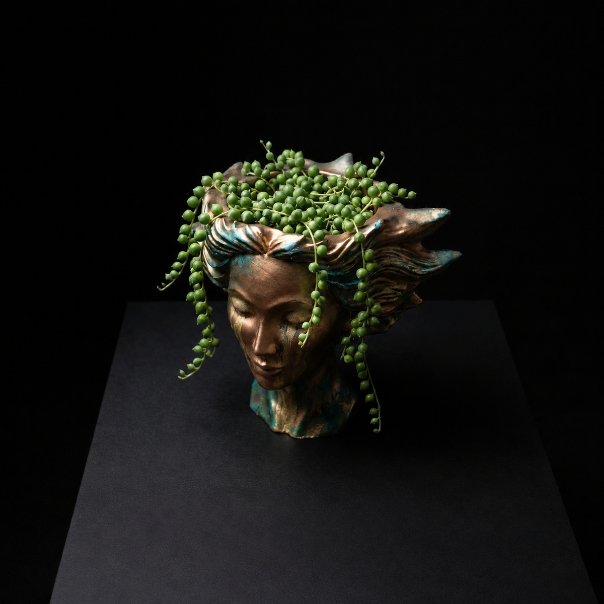 Golden Tears bust planter with trailing plant