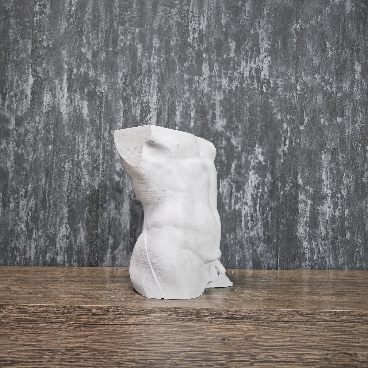 Side profile of unplanted Greek god male torso planter