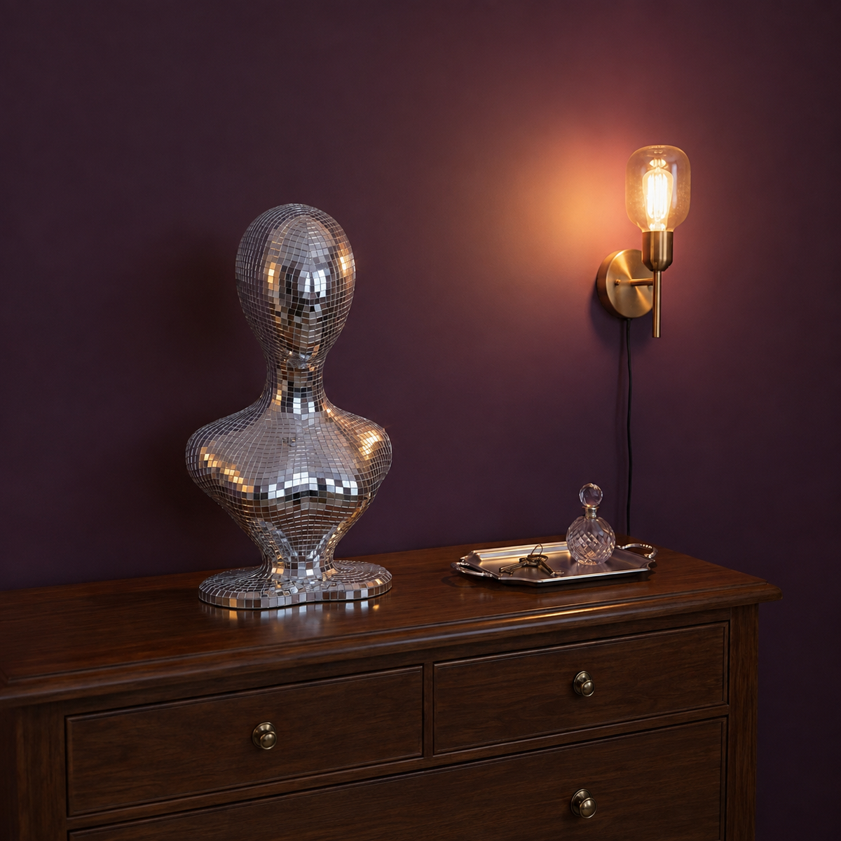 mirror ball mannequin bust on entryway console table