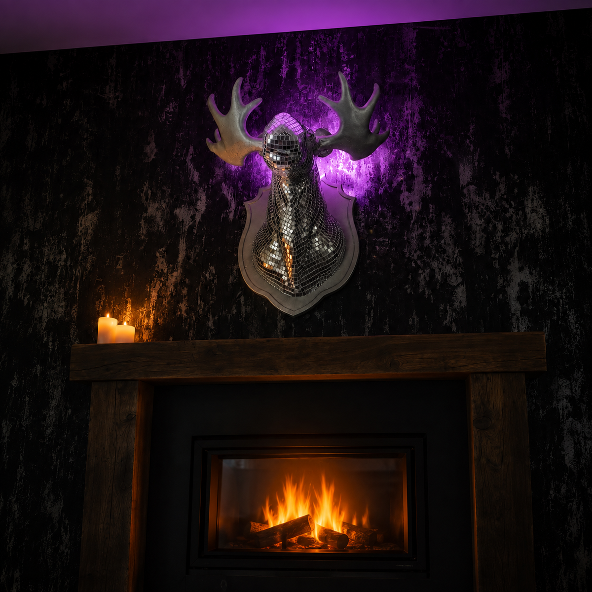 Mirrorball Moose wall art displayed above a dark fireplace mantel
