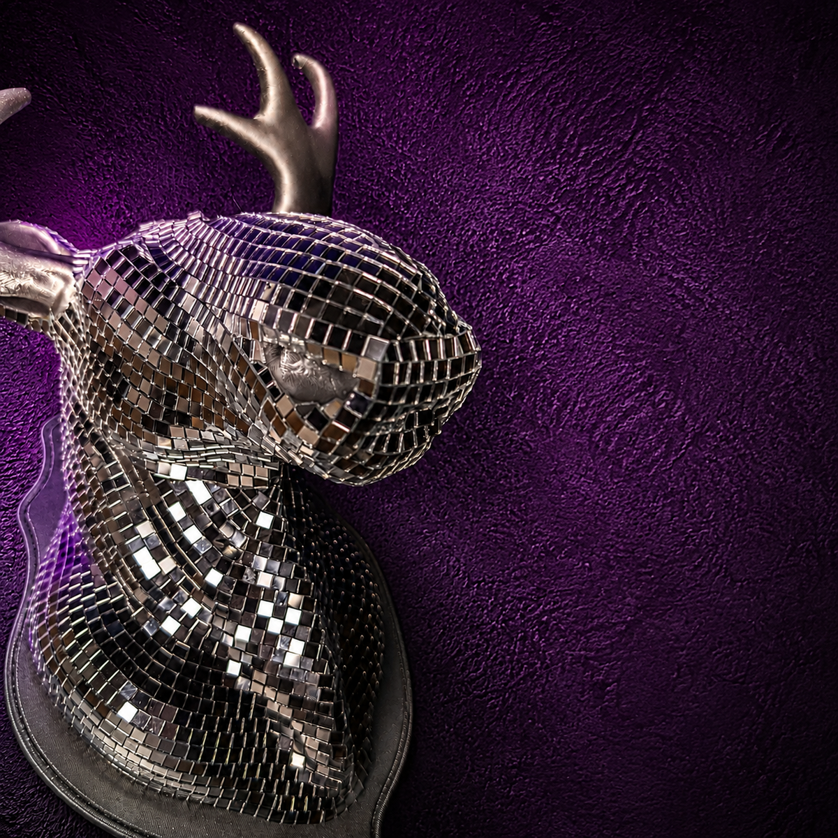Close up of Mirrorball Moose silver mirror tiles and sculpted antler detail