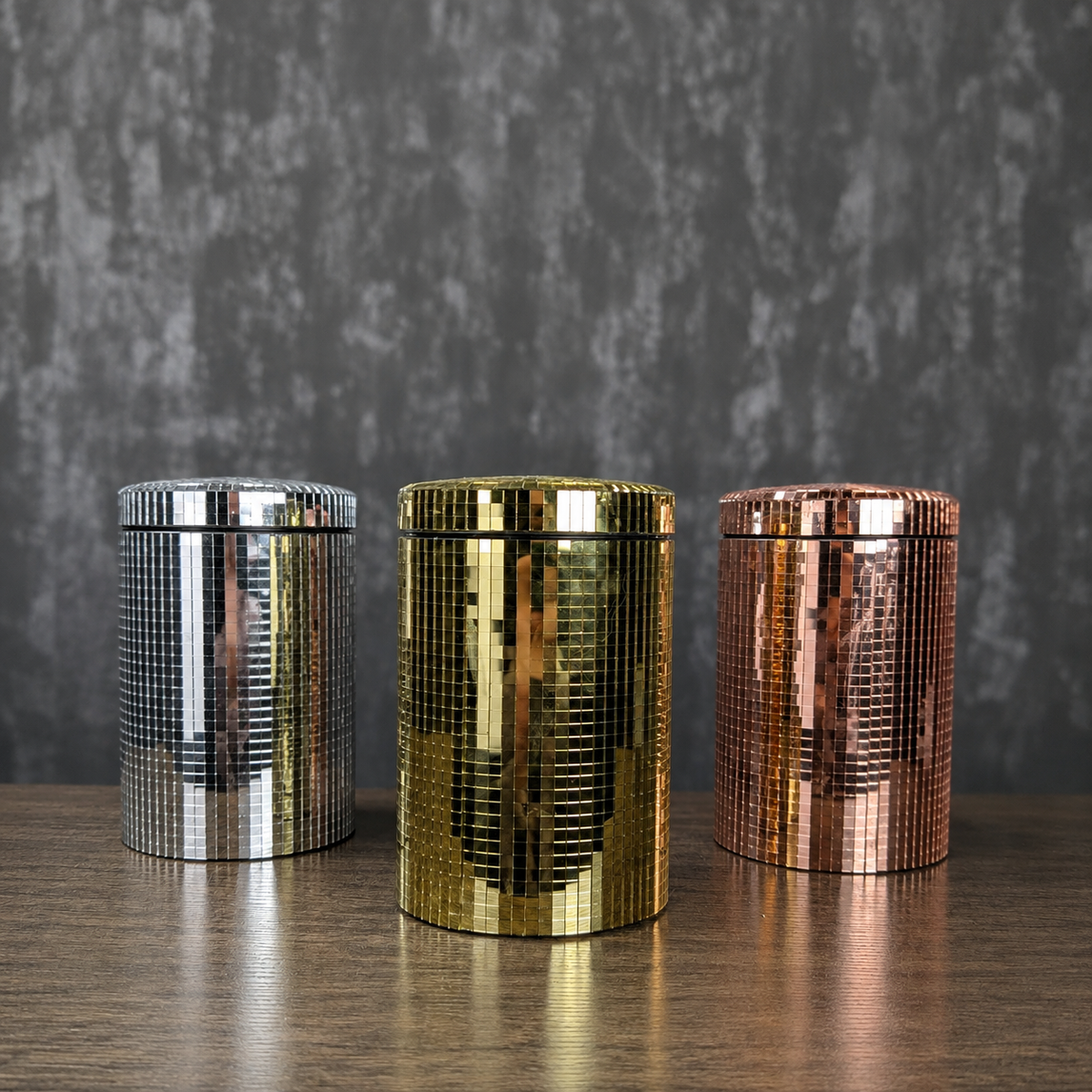 Silver, gold and rose gold mirror kitchen canisters shown front-on