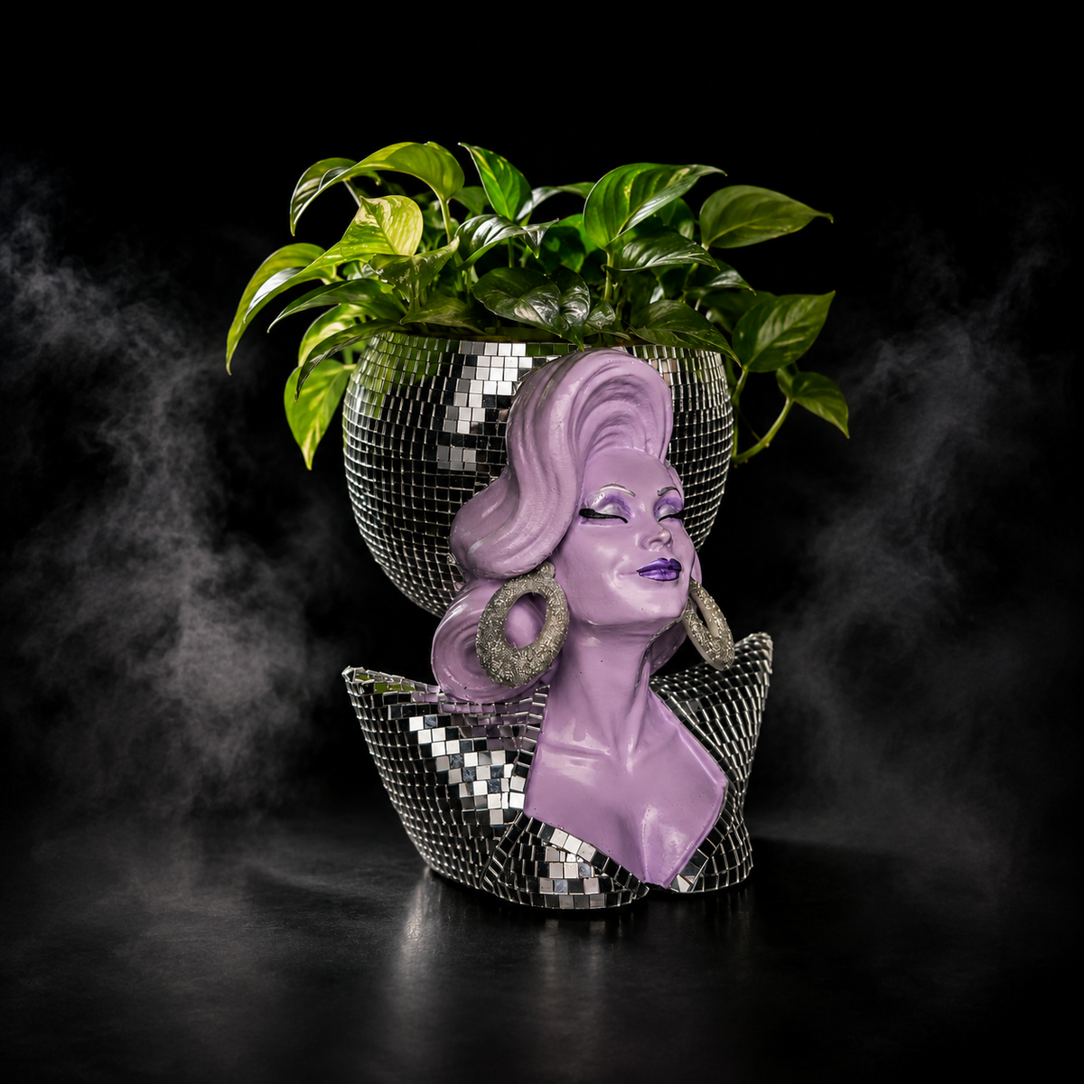 Mother Mirrorball drag queen planter styled with a green trailing plant