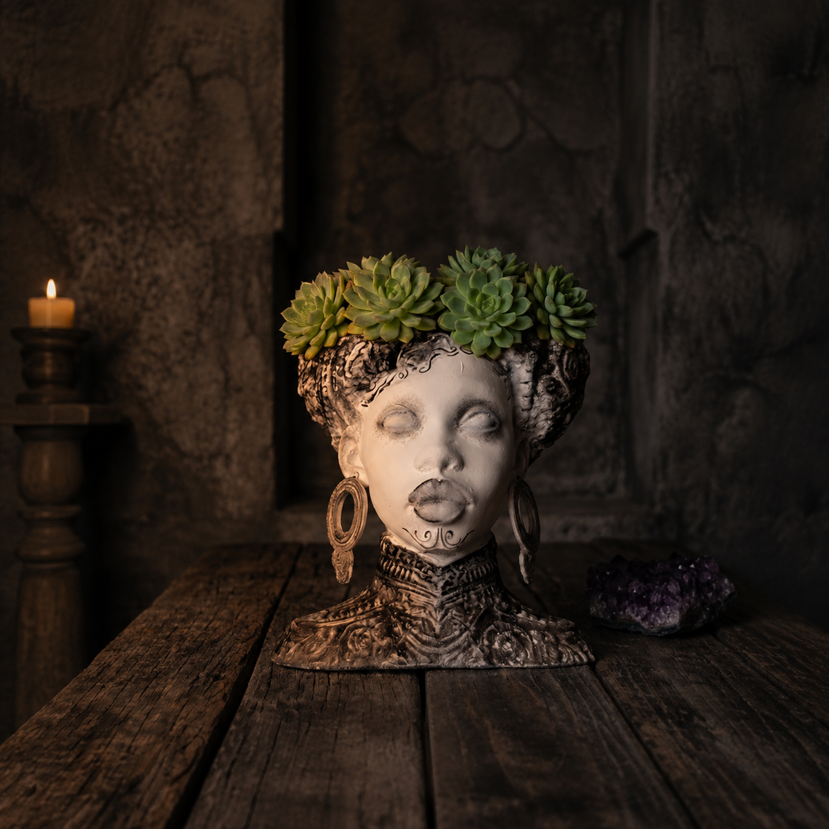 Gothic twin bowl head planter filled with green succulents on a rustic table