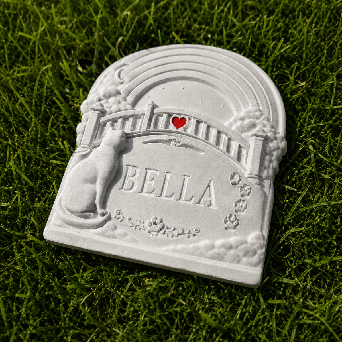 Close up of personalised Rainbow Bridge cat grave marker with name and heart detail