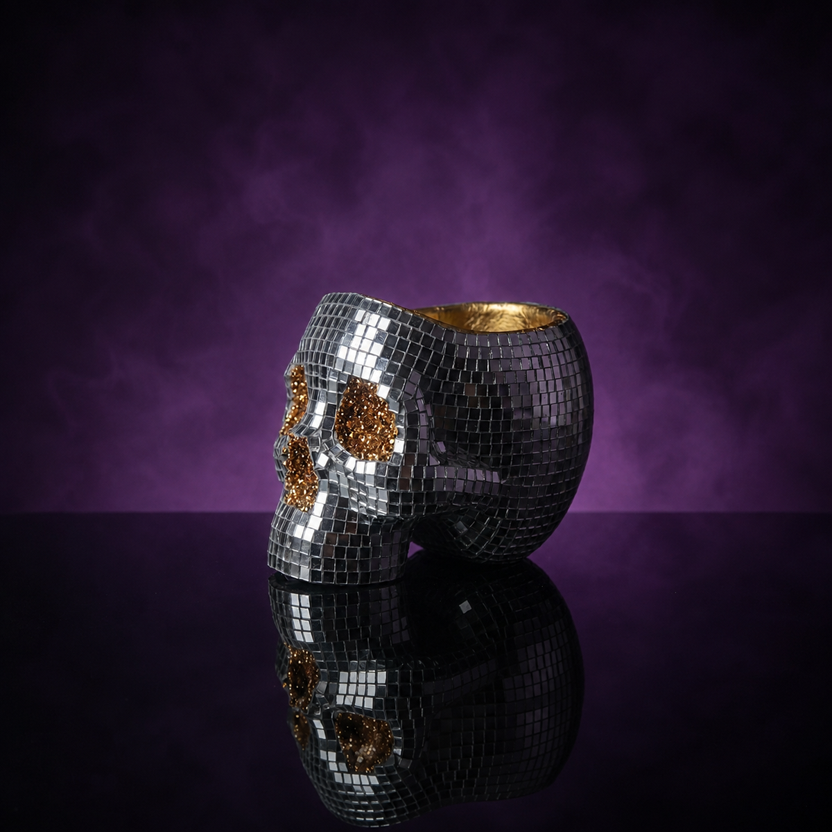 Unplanted disco skull planter in side profile on a black reflective surface