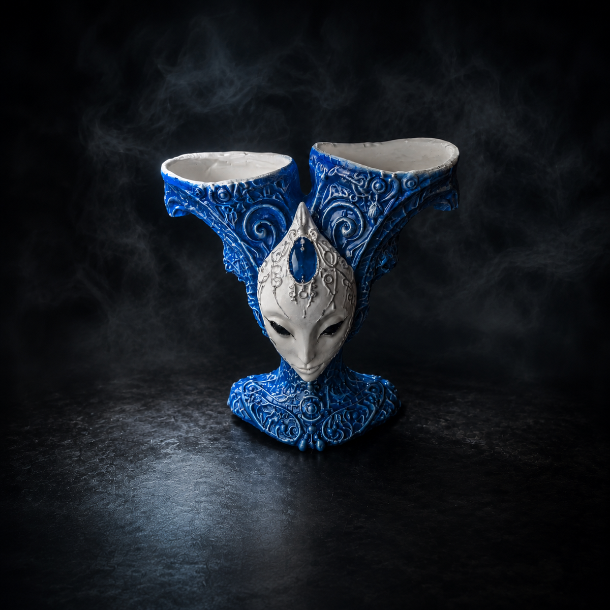 The Blue Trickster alien planter shown empty from the front
