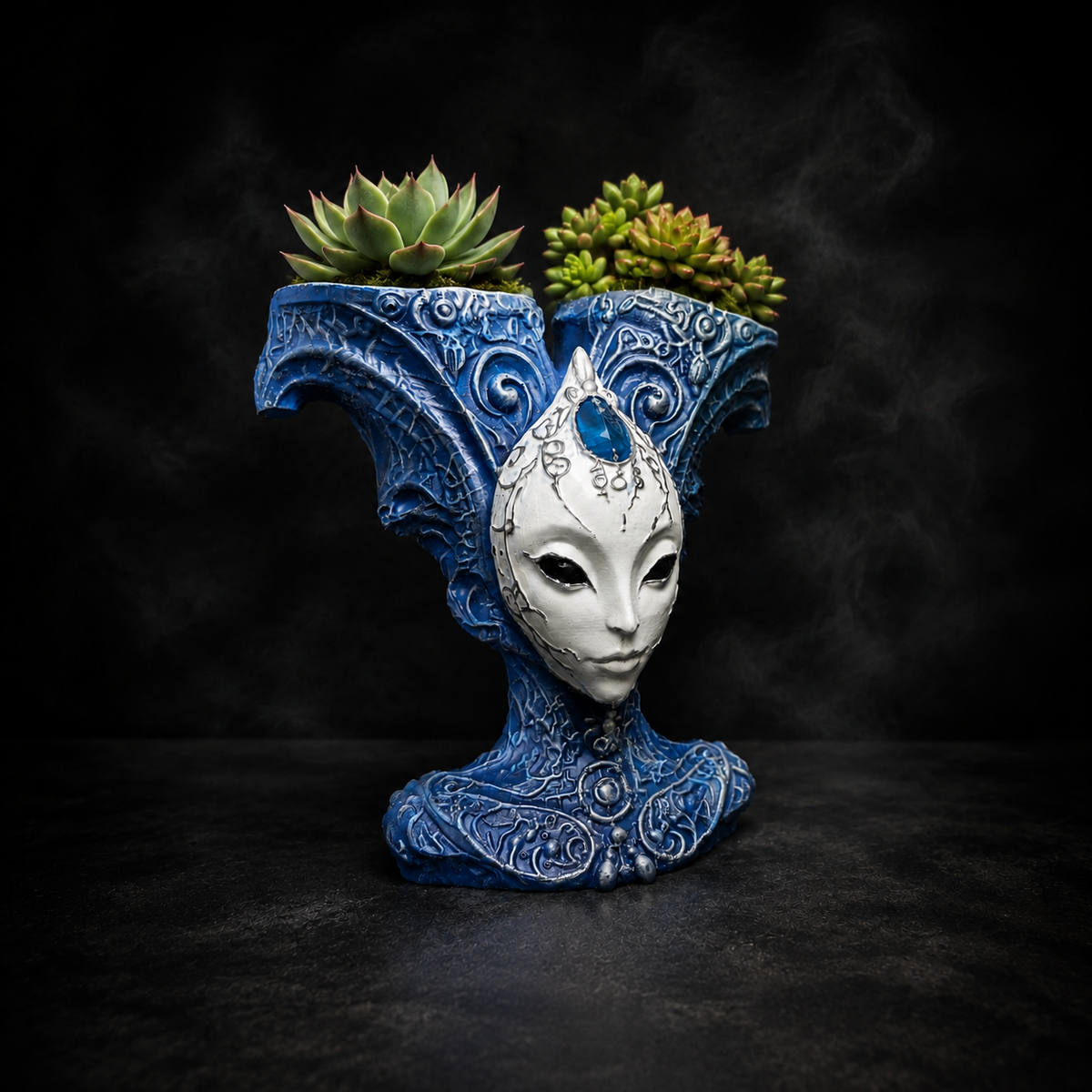 The Blue Trickster alien planter styled with succulents
