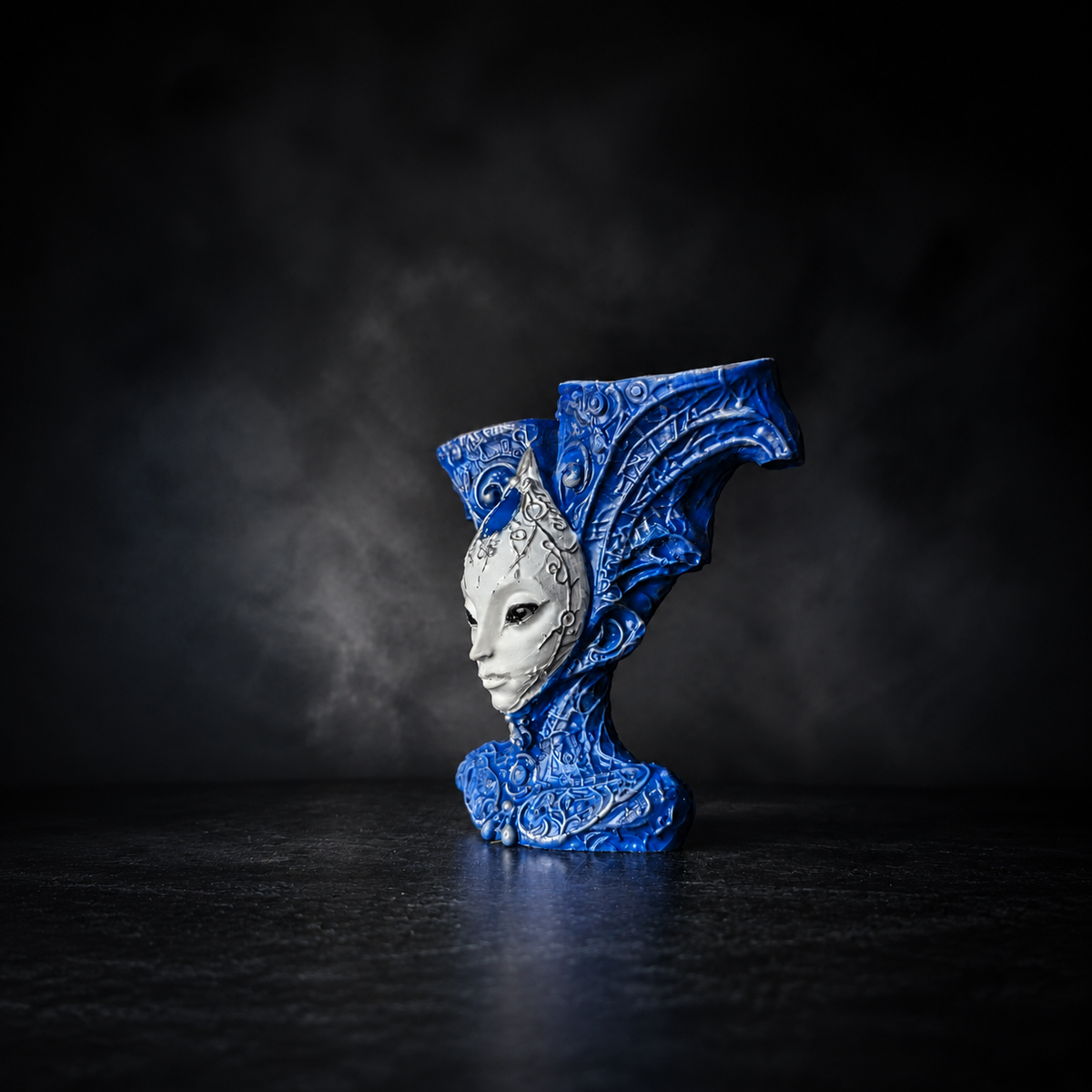 Side studio view of The Blue Trickster alien bust planter