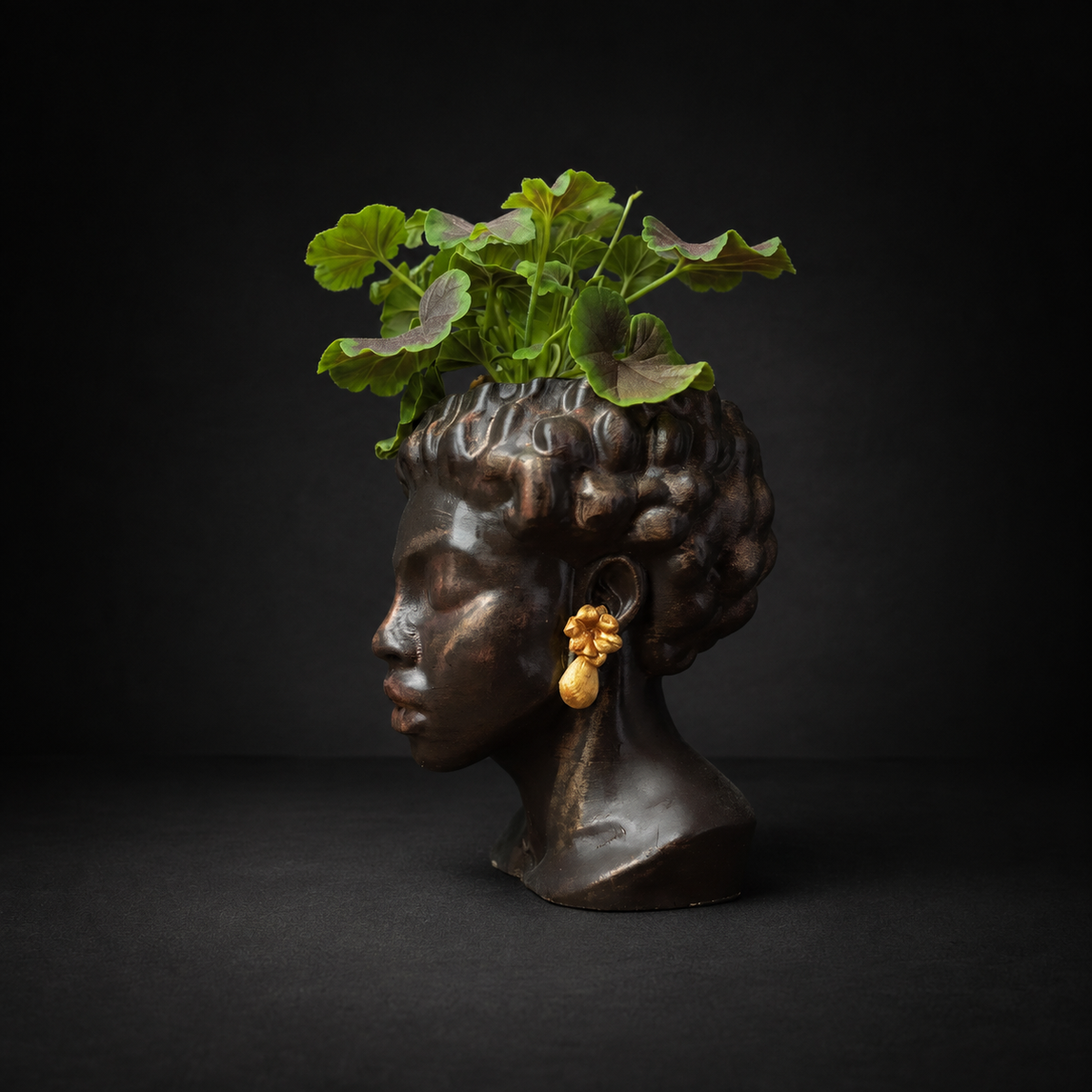 Cast stone bust planter with sculpted curly hair, right profile view