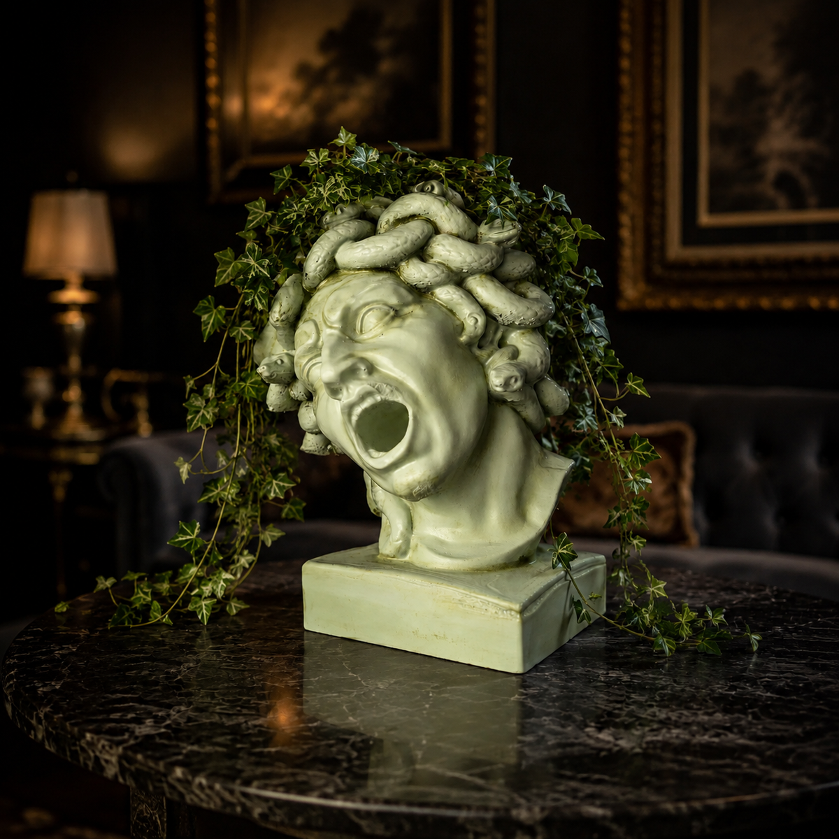 Medusa head planter styled indoors with ivy plant