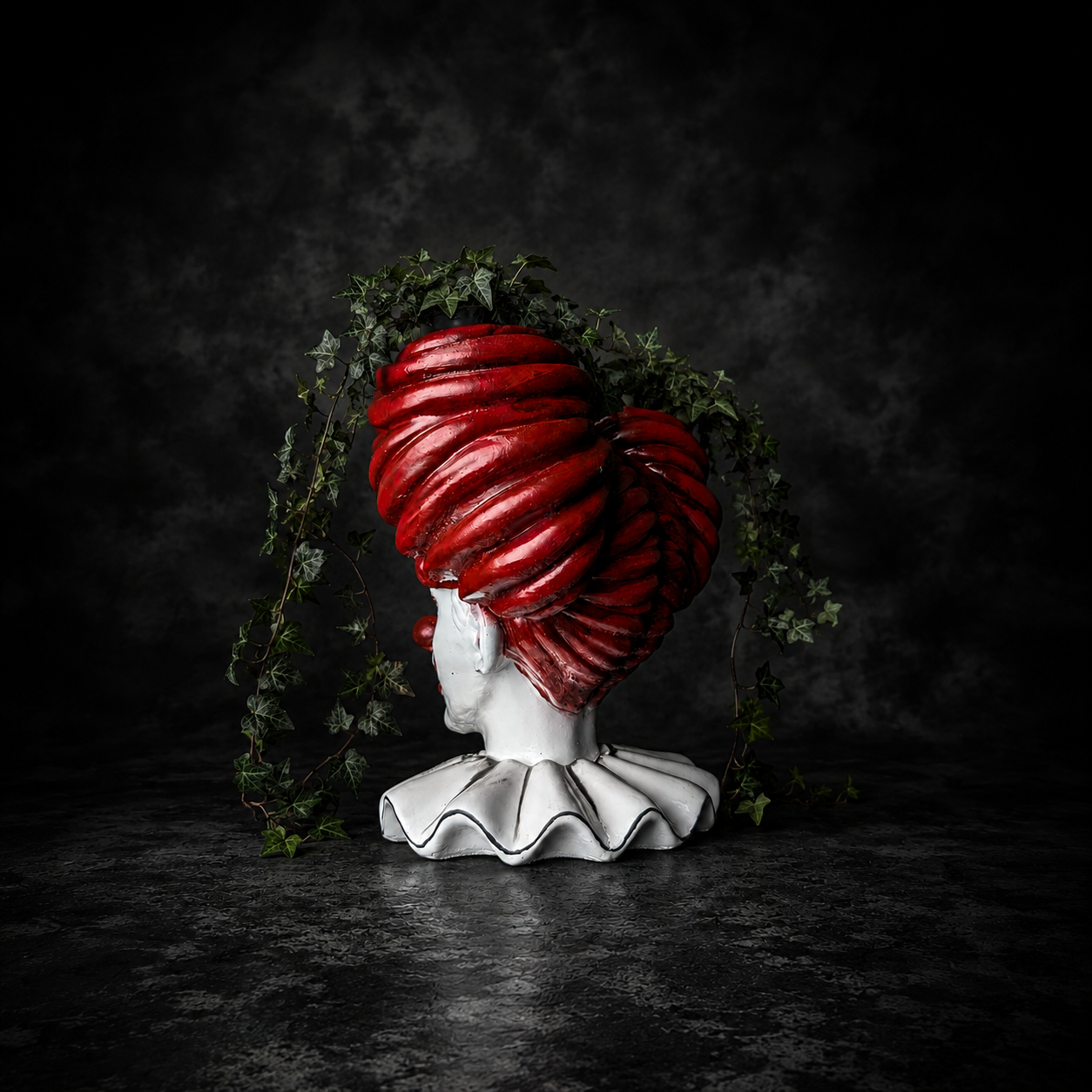 Back view of The Last Laugh planter showing sculpted red hair and twin pots