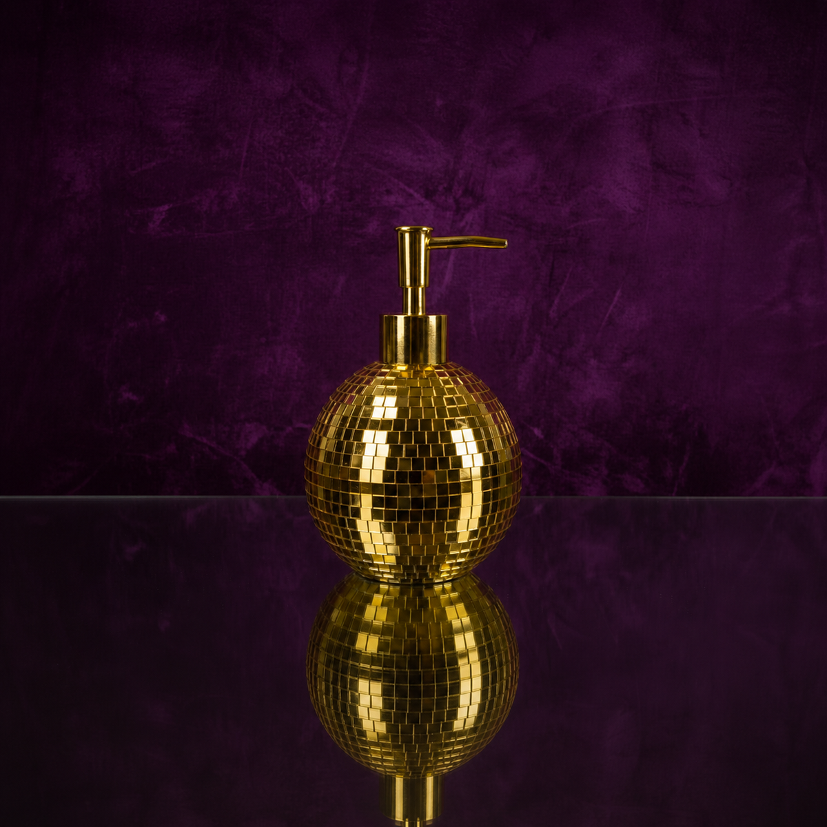 Spherical gold mirror mosaic soap dispenser close-up