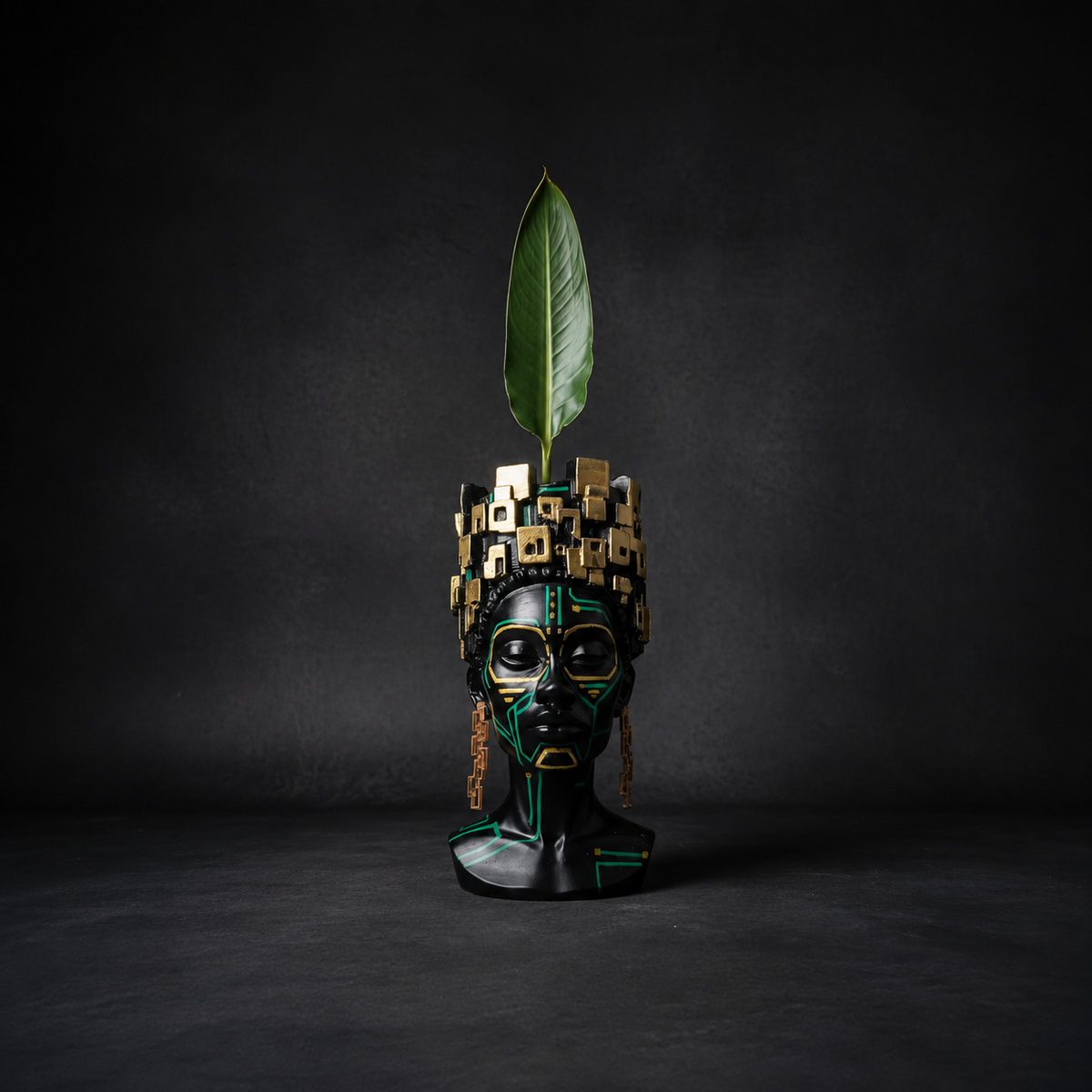 Front view of The Motherboard head planter holding a bird of paradise leaf