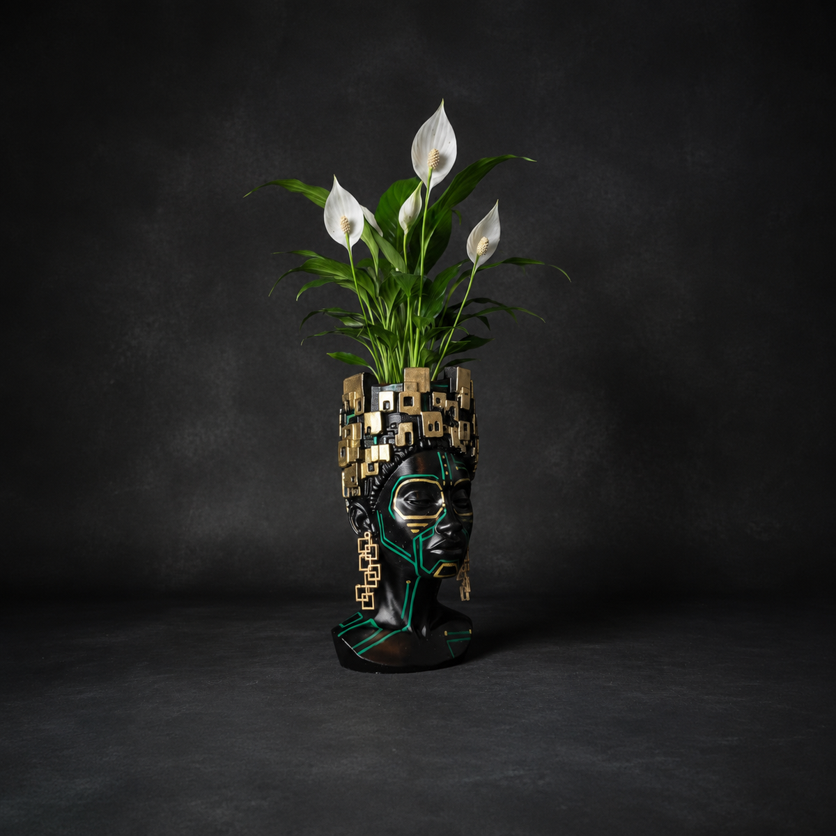 Three-quarter view of The Motherboard head planter holding a peace lily