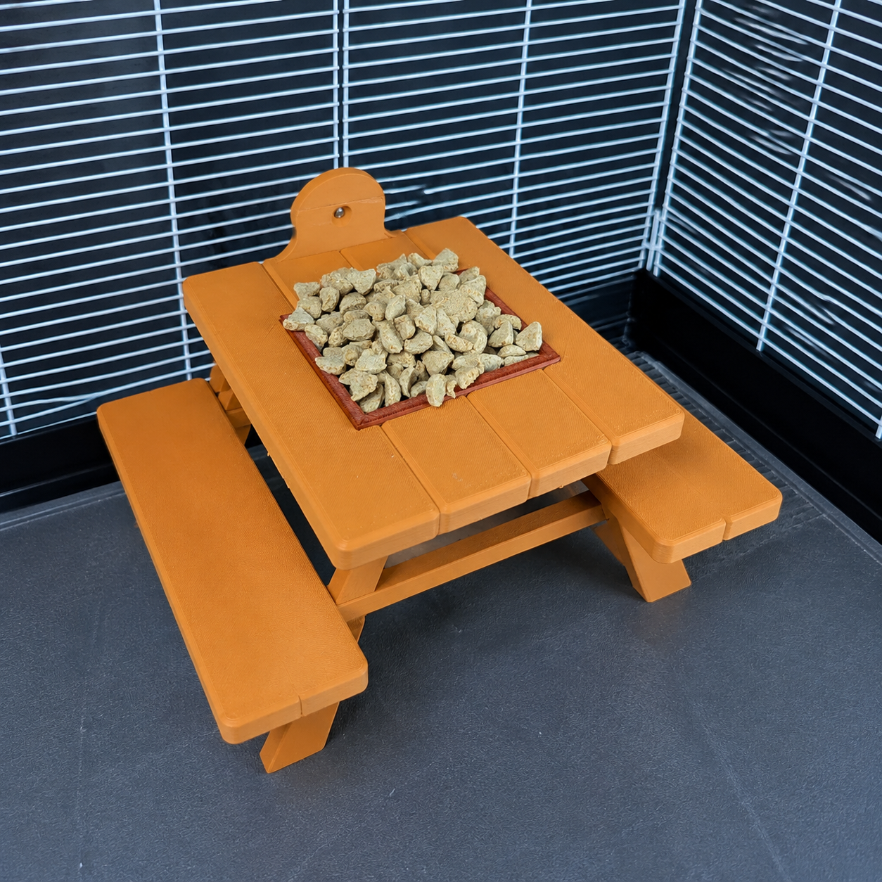 Close-up of the filled removable food bowl in the picnic bench table