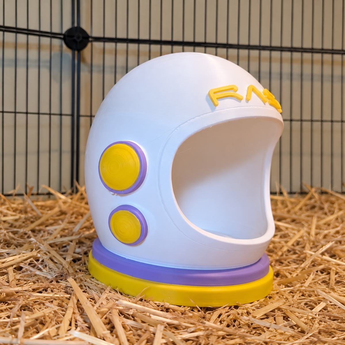 Opposite side of the ivory helmet showing two yellow discs with lilac surrounds.