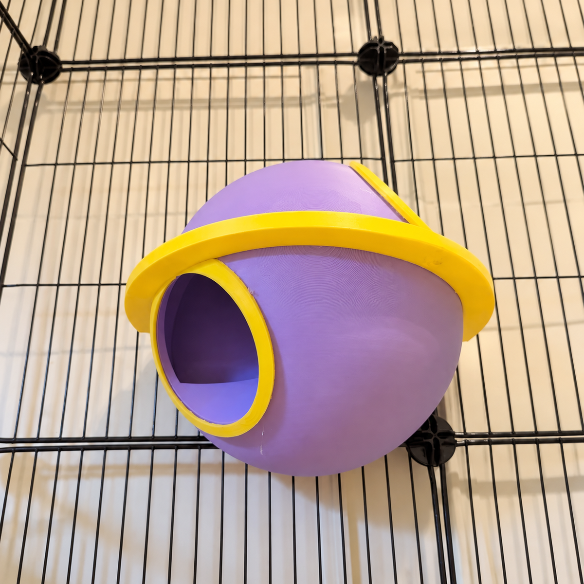 Low view of the mounted Saturn showing the lower yellow-rimmed opening and orbital ring.