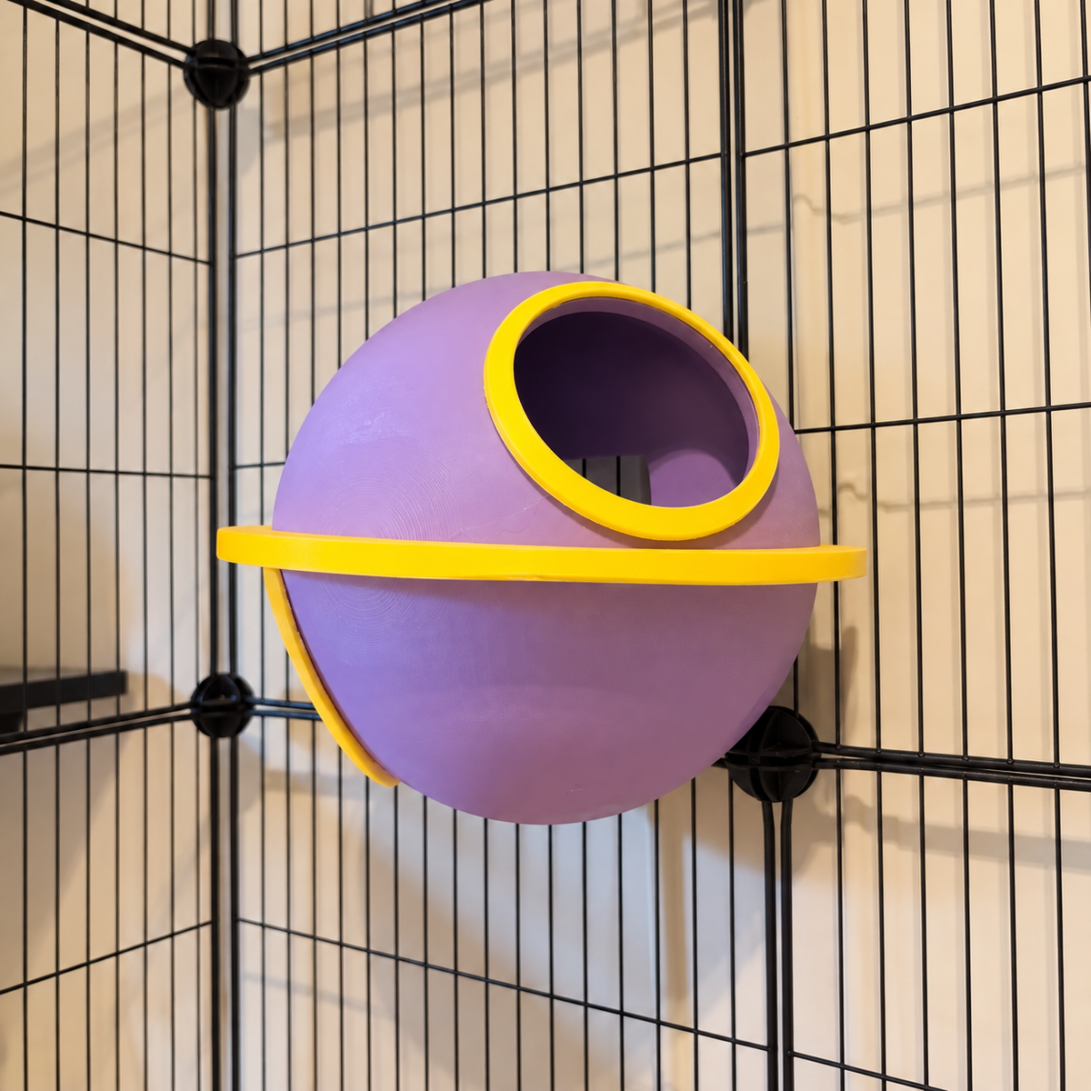 Near-front view of the lilac Saturn showing its upper opening and yellow orbital ring.