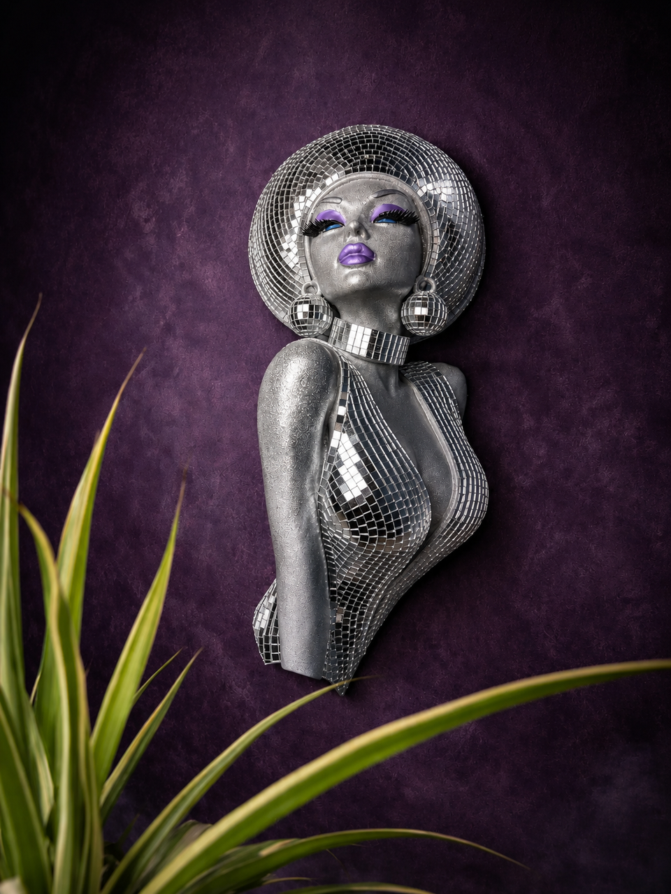 The Mirrorball Muse mirror ball bust wall art styled with plant foreground