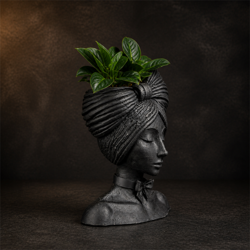 Side profile of the matte black woman head planter